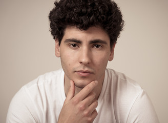 Fashion portrait of Attractive young manly man model posing happy and sexy for the camera