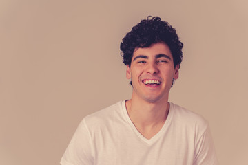 Portrait of smiling attractive cheerful young man. Happy face human facial emotions and expressions