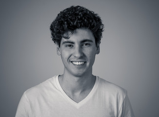 Obraz premium Portrait of smiling attractive cheerful young man. Happy face human facial emotions and expressions