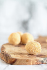 Keto pumpkin pie fat bombs. Made with pumpkin, coconut oil and other fats then coated with erythritol sugar substitue. .Selective focus with blurred background. Ketogenic diet concept .