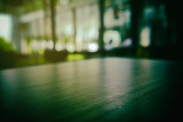 Close up Surface of Wooden Table in Cafe with Bokeh Background. (Selective Focus)