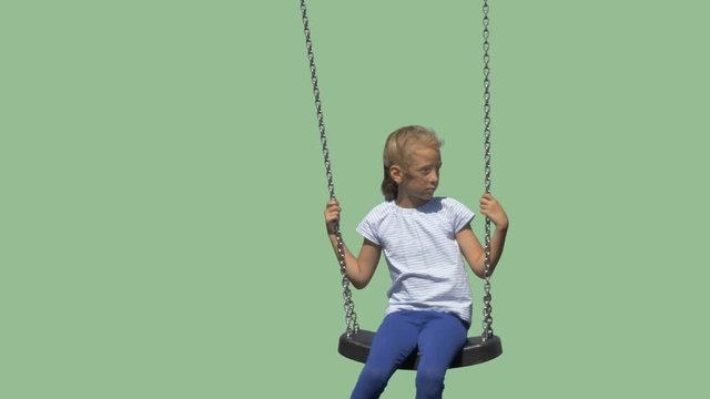 Cute little girl swinging on a swing. Alpha channel background. Lens (focal length) - 120 mm 