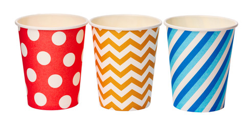 Obraz premium Paper disposable cups with colored pattern isolated on white background