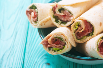 Sliced sandwich tortilla with vegetables and ham