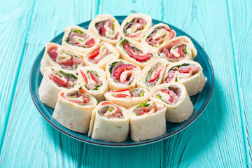 Sliced sandwich tortilla with vegetables and ham