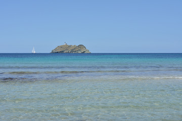 Fototapeta na wymiar Barcaggio beach and Giraglia island. Cap Corse, Corsica, France