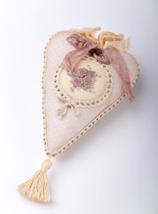 Blossoming flower of pink peony against a background of foliage.