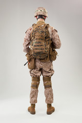 Rear view of military soldier US army marines operator studio shot portrait