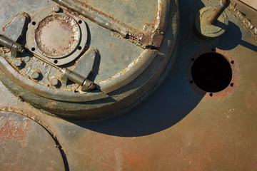 Details of the old Soviet tank. Military green camouflage metal background