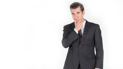 Handsome business man standing thinking and so smart and successful