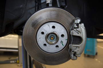 The braking system of a modern car. Brake Disc. Brake Caliper. Close-up.