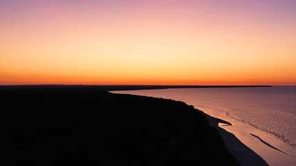Aerial view wonderful dark silver sea with sunset twilight sky in the evening time. Scenery moment. spirit of serene and zen. image for background, wallpaper, interior