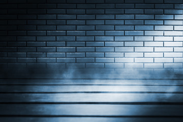 Empty scene background. Old brick wall, wooden floor. Spotlight in the dark