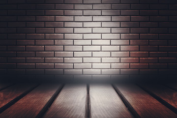 Empty scene background. Old brick wall, wooden floor. Spotlight in the dark