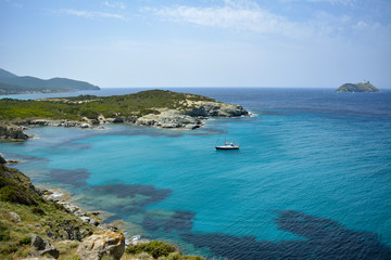 Fototapeta na wymiar Sailing boat, Cap Corse. Sentier des douaniers. Corsica island, France