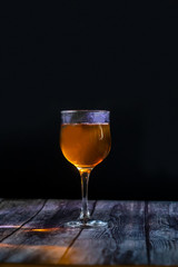 Amber wine. Wine in a glass. Traditional Georgian wine according to ancient technology. Close up