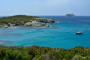 Fototapeta na wymiar Sailing boat, Cap Corse. Sentier des douaniers. Corsica island, France