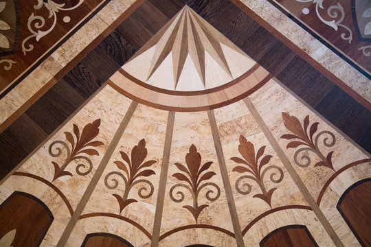 Background of parquet various wood Lily pattern converging to the centre. Backgrounds Structure Design.
