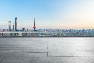 Empty square floor and city skyline with buildings at sunset in Shanghai,China.