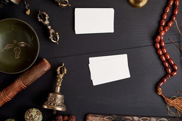empty white business cards in the midst of Asian religious objects