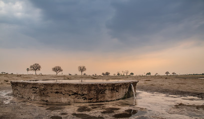 Water pump reservoir in Africa overflowing after rain