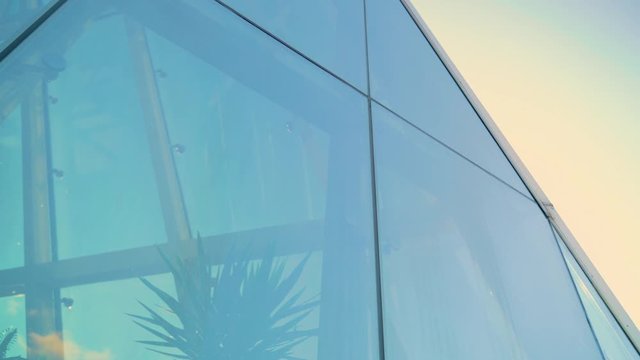 Glass Curtain Facade Wall. Fasteners Elements of Spider Glass System. Facade Detail. Architecture Abstract Background. Pan to Right