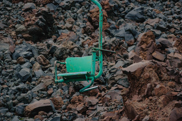 an old chairlift . lifts to the hills lift green