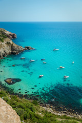 Yachts in the bay of the blue tropical sea