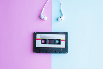 retro of tape cassette on blue and pink background. soft focus.