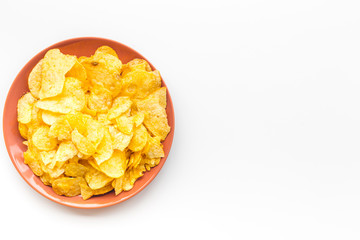Potato crisps in bowl on white background top view mockup