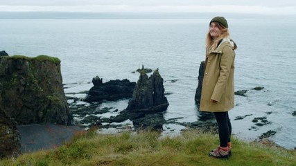 Female traveller enjoys epic landscape in iceland