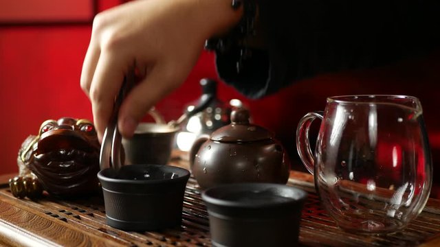 a man brews PU-erh tea according to traditional Chinese customs