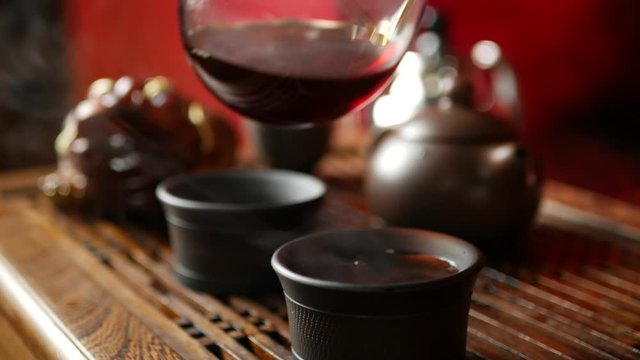 a man brews PU-erh tea according to traditional Chinese customs