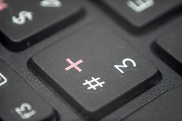 Close up of the number 3 and pound key on a keyboard