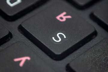 Fototapeta premium Close up of the letter S on a keyboard