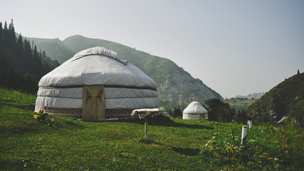 Yurts on the top of the mountain, summer green landscape in Kazakhstan Almaty, nature of Zailiysky Alatau