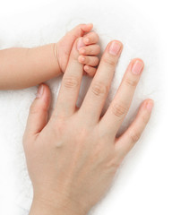 Obraz na płótnie Canvas hands of mother and baby