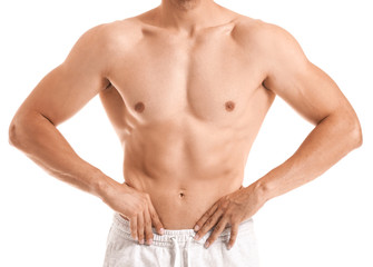 Handsome muscular man on white background. Weight loss concept