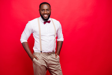 Photo of dark skin manager guy wear specs white shirt pastel pants isolated red background