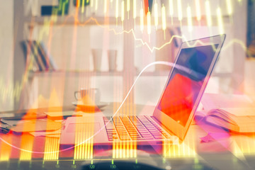 Forex market chart hologram and personal computer background. Multi exposure. Concept of investment.