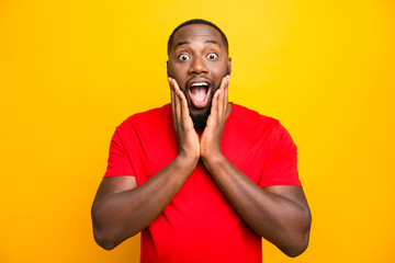 Photo of excited ecstatic rejoicing overjoyed black man admiring something adoring while isolated...
