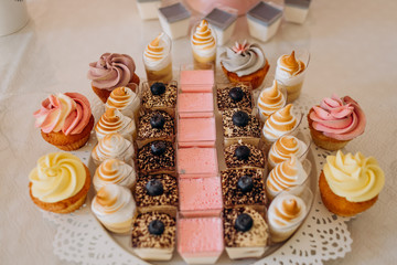 Pastel color cakes. Sweet table