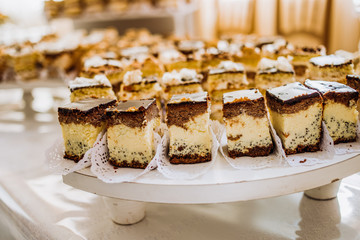 Pieces of cakes on a banquet table