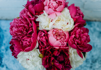 Bright bouquet of peonies of pink shades