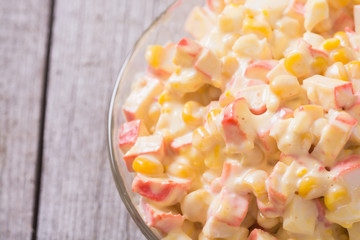 Salad with crab sticks , corn , eggs and mayonnaise