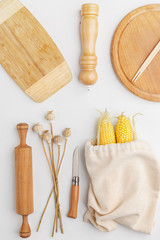 Composition of wooden cutting boards and wooden utensils and kitchen utensils. Top view.