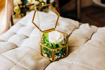 Glass casket with wedding rings inside