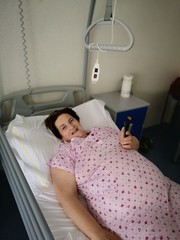 Obraz na płótnie Canvas Obese old woman in hospital bed
