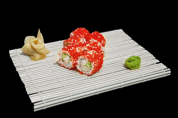 Close-up of sushi and rolls in the restaurant kitchen. Japanese traditional cuisine. California...