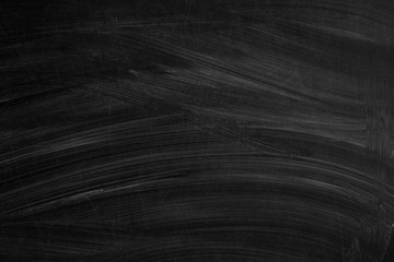 School blackboard background. Empty black chalkboard texture with chalk traces